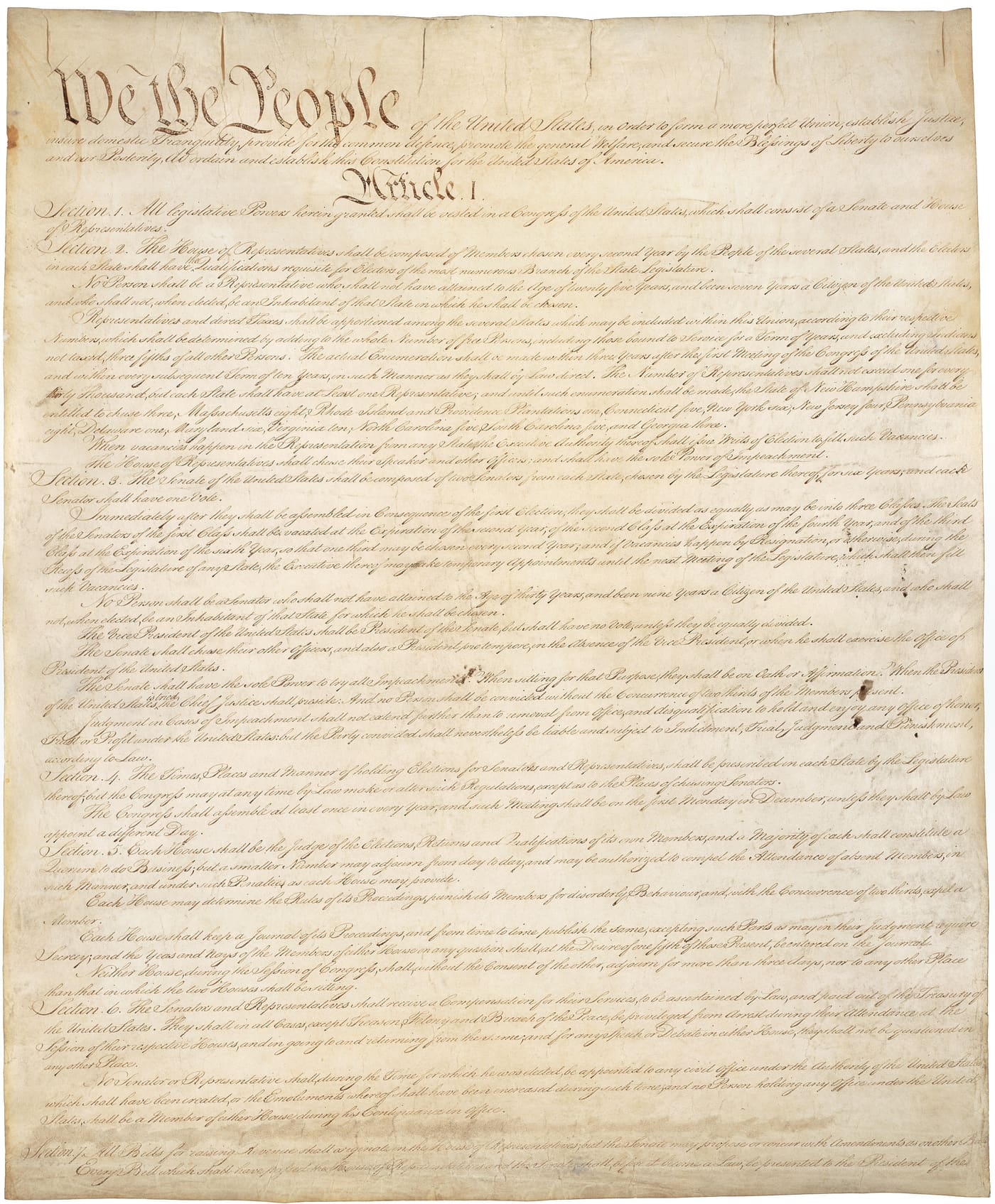 The first page of the United States Constitution, beginning “We the People”